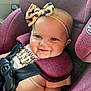 baby, child, car_seat, headband, leopard_print, bow, smile, blue_eyes, infant, seatbelt, child_safety, cute, happy, portrait, closeup, pink_clothing, plush, car_interior, straps, young_child