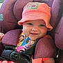 baby, child, car_seat, hat, pink, purple, smiling, straps, safety, seatbelt, cute, infant, happy, portrait, clothing, indoors, face, person, closeup, seat
