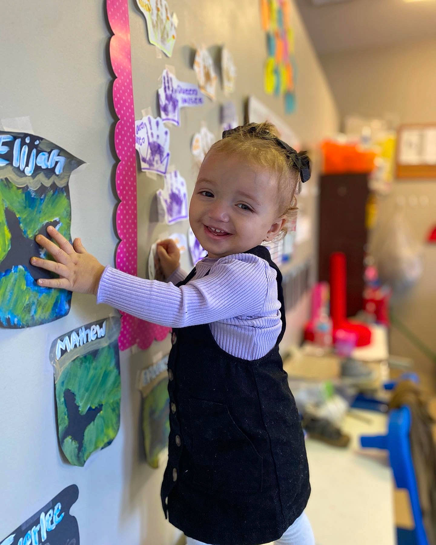 Cali is registered to the contest to win money with this photo: art, artist, baby, baby_toddler_clothing, child, fun, gesture, hairstyle, happy, joy, kindergarten, leisure, office_supplies, pattern, person, play, room, sleeve, smile, t_shirt