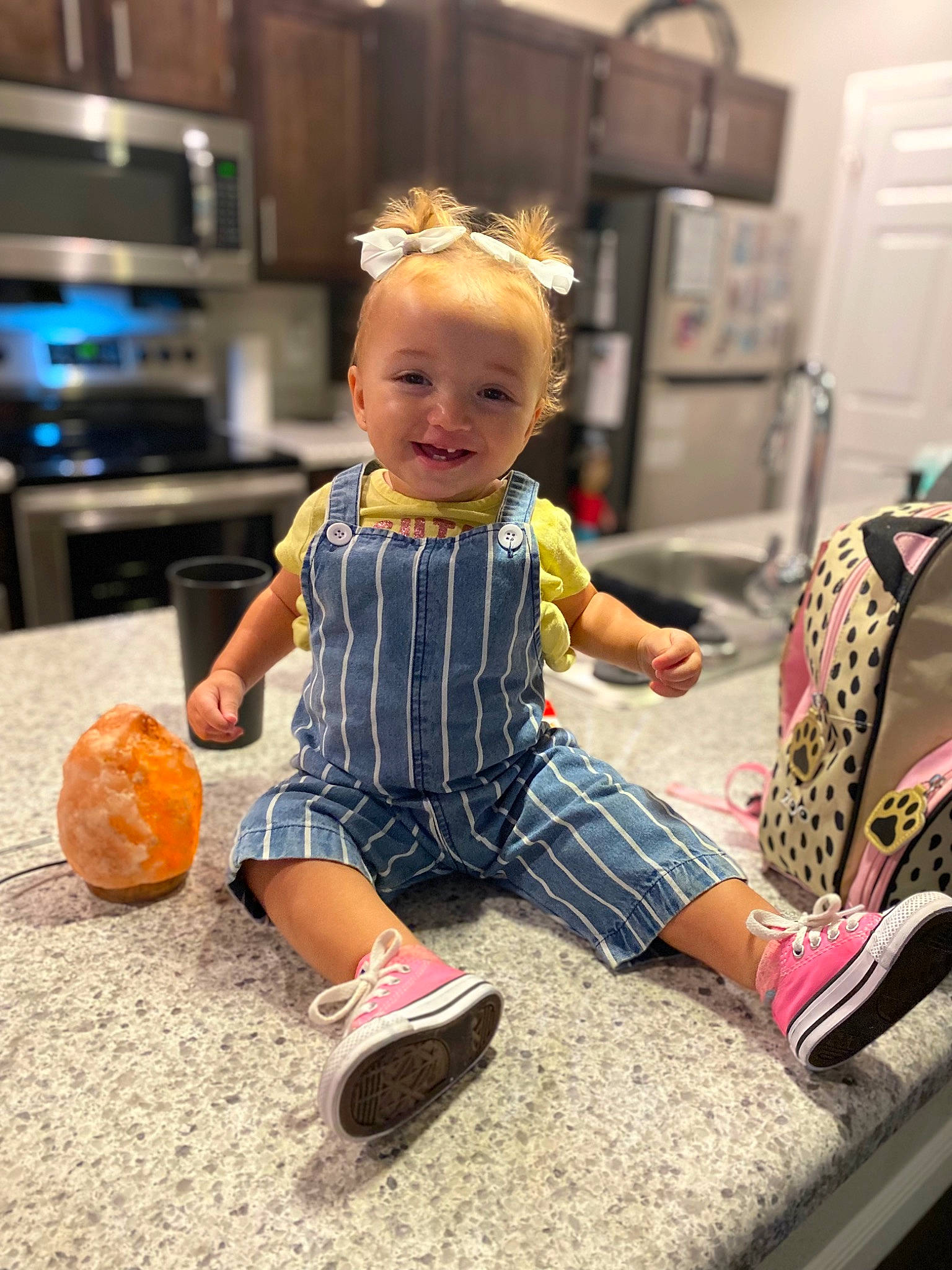 Cali is registered to the contest to win money with this photo: baby, baby_toddler_clothing, blond, calabaza, child, cucurbita, flooring, fun, happy, home_appliance, human_leg, joint, joy, kitchen_appliance, person, pumpkin, refrigerator, shoe, shorts, sock