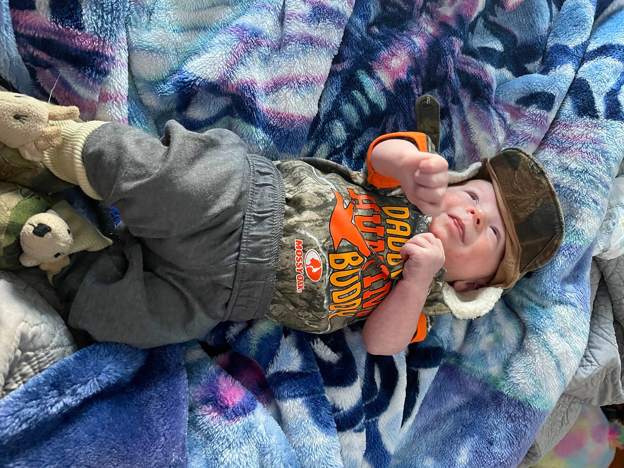 Hudson is registered to the contest to win money with this photo: baby, baby_products, child, comfort, fun, happy, headwear, leisure, linens, nap, pattern, person, purple, room, sitting, sleep, smile, t_shirt, textile, toddler