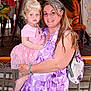 child, woman, portrait, smile, dress, pink, purple, carousel, horse, amusement_park, hair, braids, toddler, holding, happy, clothing, person, indoor, background, bag