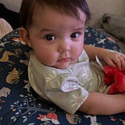 Bella joined the competition — help win amazing prizes! baby, child, infant, face, eyes, plush_toy, cushion, pattern, animal_print, clothing, earrings, person, indoor, cute, soft_lighting, portrait, seated, expression, young, skin