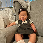 architecture, baby, bodypart, chair, clothing, couch, cushion, face, finger, furniture, hand, hat, head, homedecor, hosiery, person, photography, portrait, sitting, sock