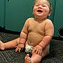 Roman joined the competition — help win amazing prizes! baby, carpet, child, chubby, cute, diaper, door, floor, foot, furniture, hand, happy, home, indoor, laughing, person, sitting, skin, smile, wood_floor