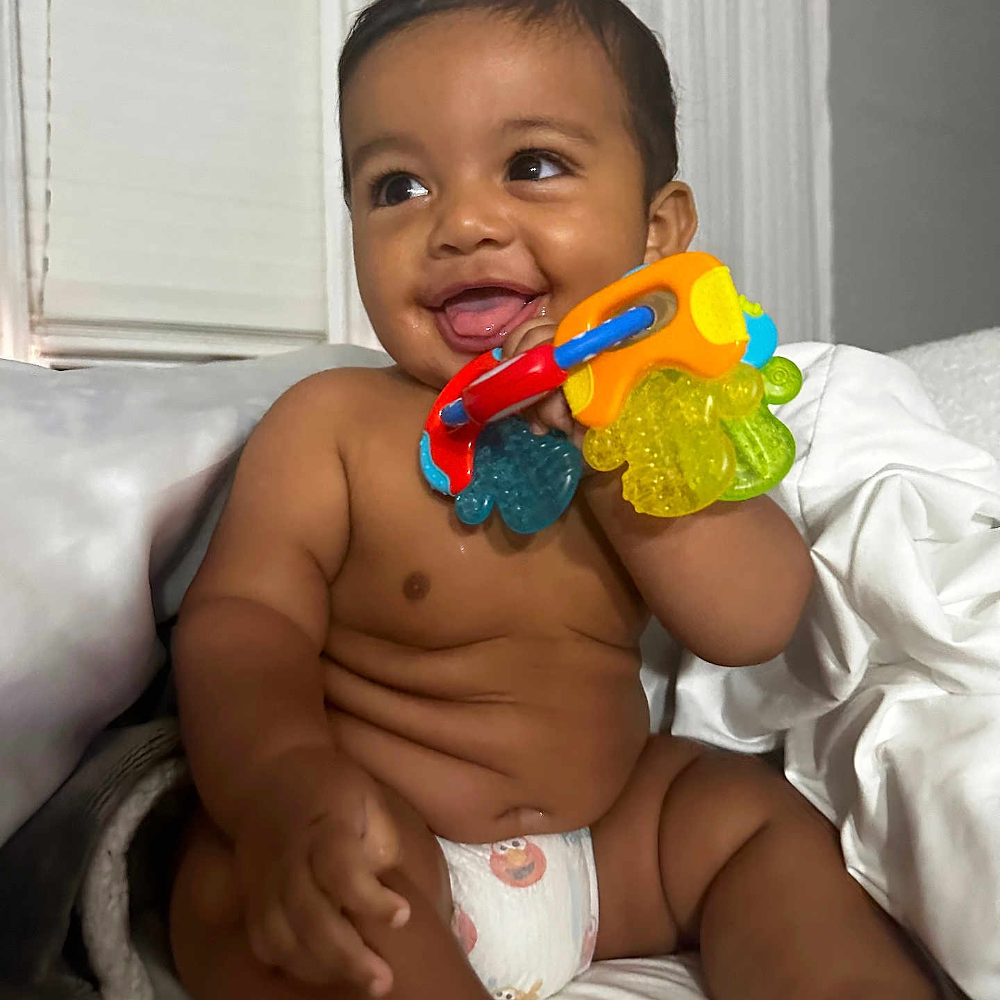 Eli is registered to the contest to win money with this photo: architecture, baby, bodypart, building, couch, cushion, diaper, face, finger, furniture, hand, happy, head, hospital, person, photography, portrait, sitting, smile, toy