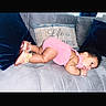 Walthour is registered to the contest to win money with this photo: adorable, baby, blue_pillow, child, couch, cozy, curly_hair, cute, decorative_pillow, gray_couch, home, indoor, infant, lying_down, pillow, pink_outfit, portrait, resting, small_shoes, soft_furniture