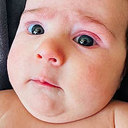 Alisha is registered to the contest to win money with this photo: baby, background, cheeks, child, closeup, cute, expression, eyes, face, head, human, infant, lying, mouth, newborn, nose, portrait, skin, soft, young