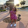 car, child, cute, fashion, footwear, girl, hello_kitty, outdoor, parking_lot, pavement, pink_dress, playful, pose, shadow, sidewalk, sunglasses, sunlight, sunset, tree, white_shoes