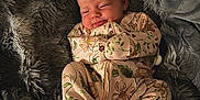 Maisie joined the competition — help win amazing prizes! baby, blanket, child, clothing, comfort, cozy, cute, floral_pattern, indoors, infant, newborn, onesie, peaceful, portrait, resting, sleeping, smiling, soft_texture, toddler, warm