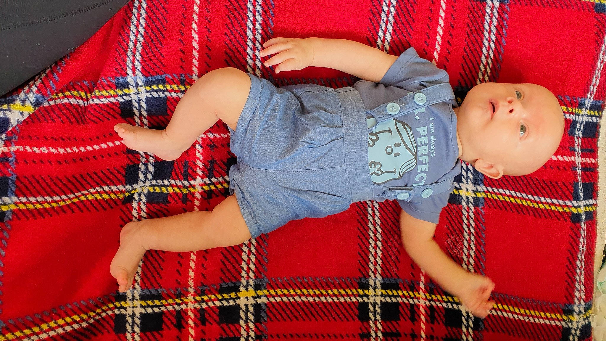 Jakub is registered to the contest to win money with this photo: baby, child, design, pattern, person, plaid, red, tartan, textile, toddler