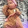 Marley joined the competition — help win amazing prizes! baby, bedspread, child, clothing, cute, floral_pattern, headband, indoors, infant, newborn, onesie, pacifier, peaceful, pink_bow, portrait, resting, sleep, sleeping, soft_lighting, toddler