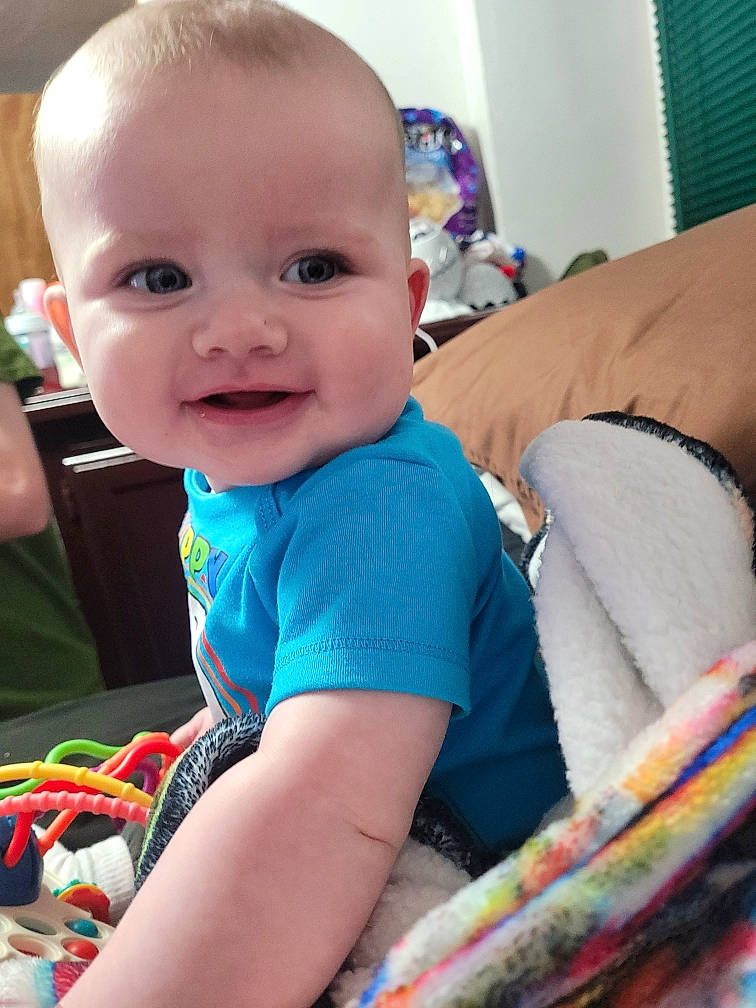 Thomas joined the competition — help win amazing prizes! azure, baby, baby_toddler_clothing, cheek, child, comfort, couch, elbow, electric_blue, finger, fun, hairstyle, happy, iris, joy, linens, person, sitting, skin, sleeve