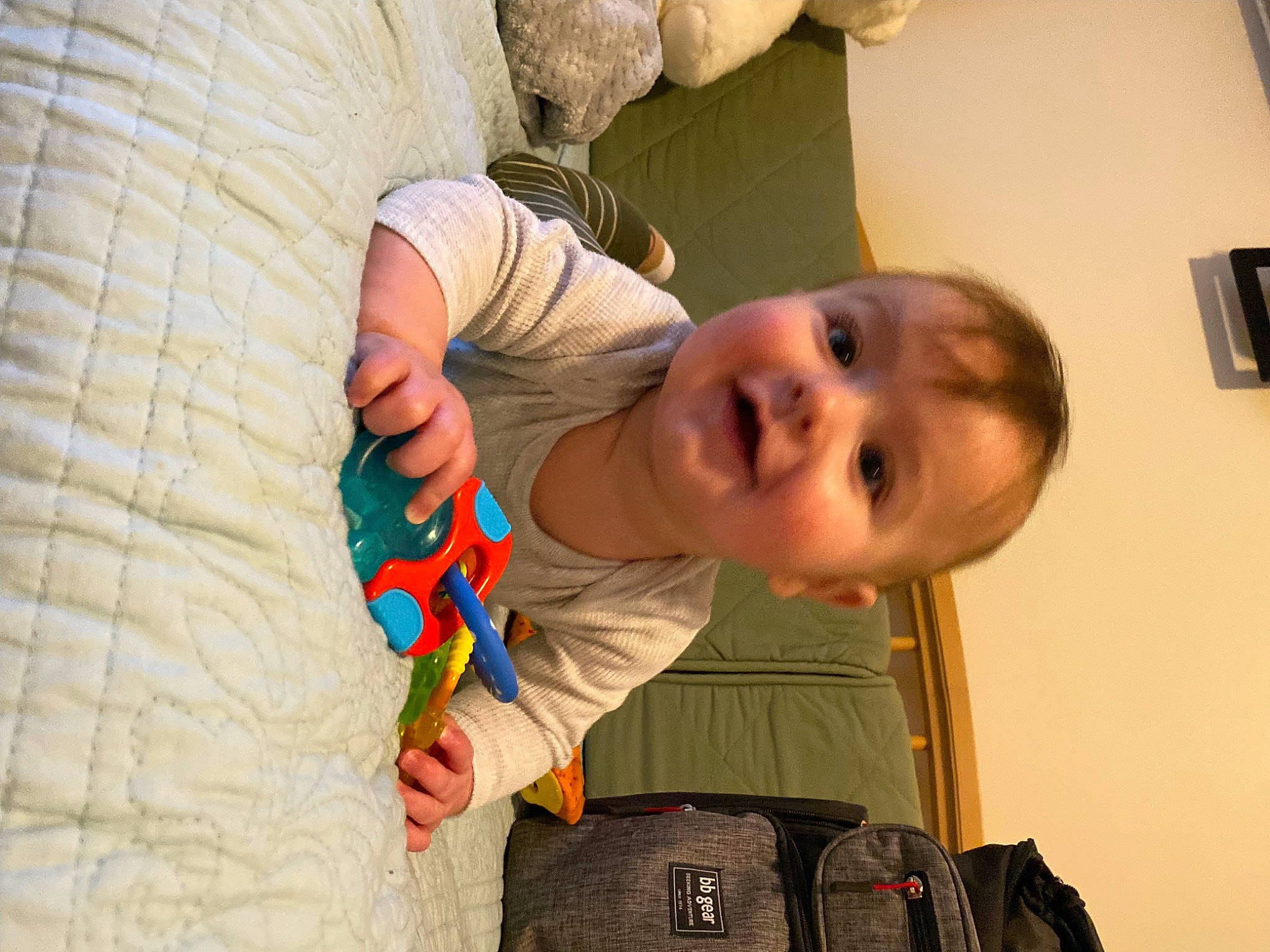 Xander is registered to the contest to win money with this photo: baby, baby_toddler_clothing, bag, cheek, child, comfort, eye, finger, happy, head, human_body, joint, luggage_and_bags, mouth, nose, person, skin, sleeve, smile, toddler