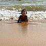child, beach, water, waves, sand, smiling, happy, playing, summer, ocean, shore, sunlight, fun, holiday, people, swimming, relaxation, outdoor, vacation, nature