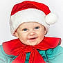 baby, child, santa_hat, red_bow, smiling, blue_eyes, holiday, christmas, festive, cute, face, portrait, infant, costume, red, green, happy, closeup, celebration, seasonal