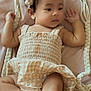 Brynn joined the competition — help win amazing prizes! baby, infant, child, headband, gingham, dress, blanket, rope, soft_texture, skin, cute, portrait, laying_down, indoors, relaxed, peaceful, small_hands, small_feet, expression, young