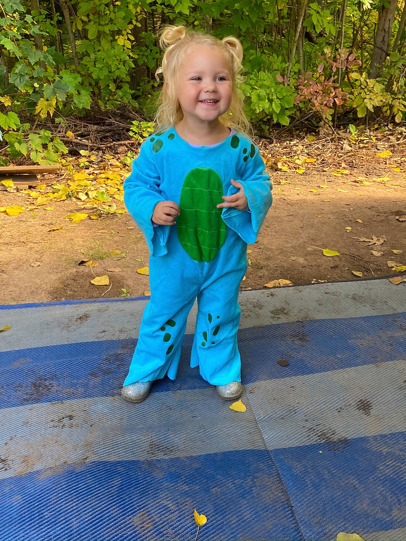 Aubree is registered to the contest to win money with this photo: active_pants, autumn, baby_toddler_clothing, deciduous, joy, leaf, nose, overall, pajamas, people_in_nature, person, play, sweatpant