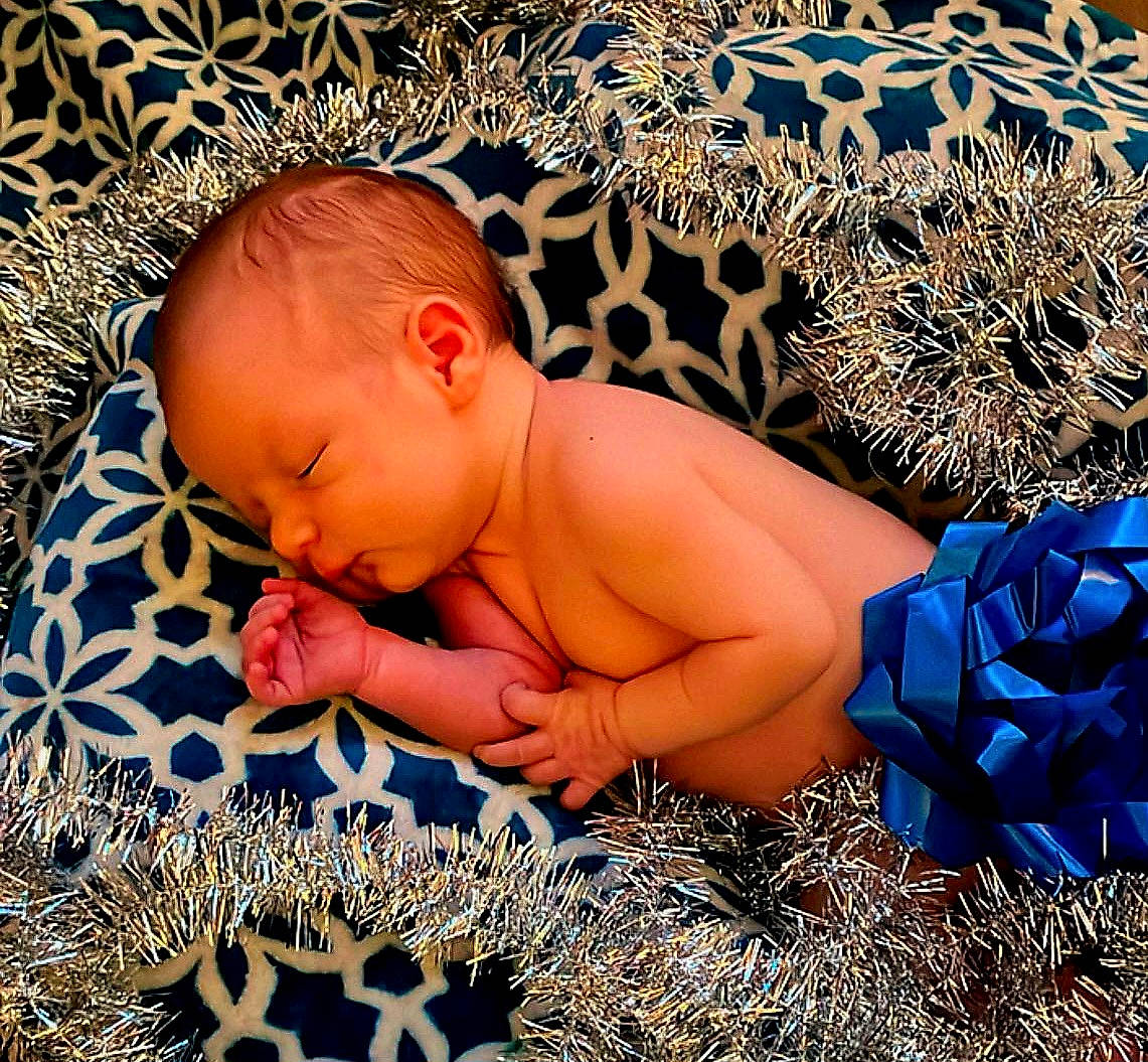 Brady is registered to the contest to win money with this photo: art, baby, barechested, bathing, bedtime, chest, child, comfort, electric_blue, flesh, flooring, fun, happy, illustration, leisure, linens, pattern, people_in_nature, person, toddler