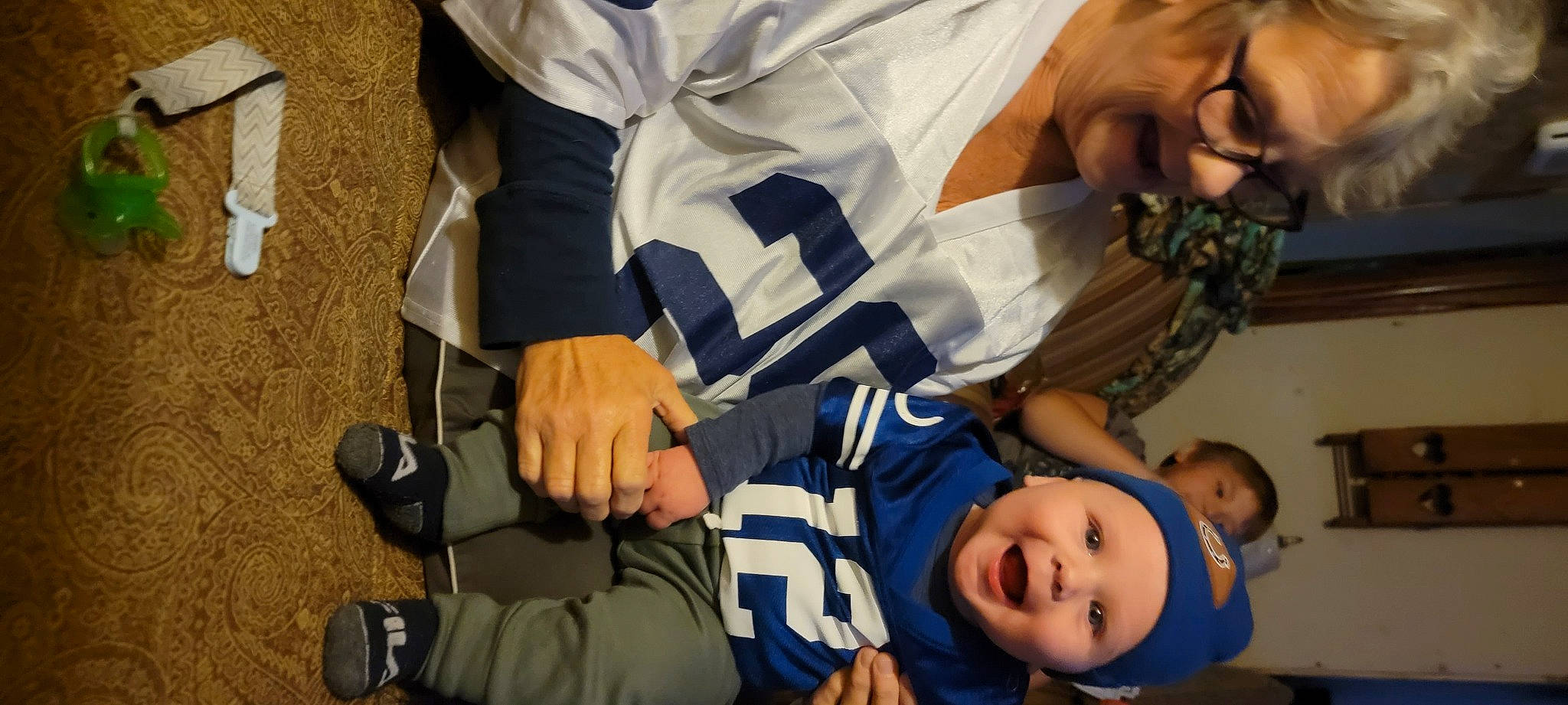 Caysen joined the competition — help win amazing prizes! child, competition_event, event, fun, gesture, happy, headwear, person, player, room, sitting, smile, team, team_sport, thumb, toddler, uniform, white