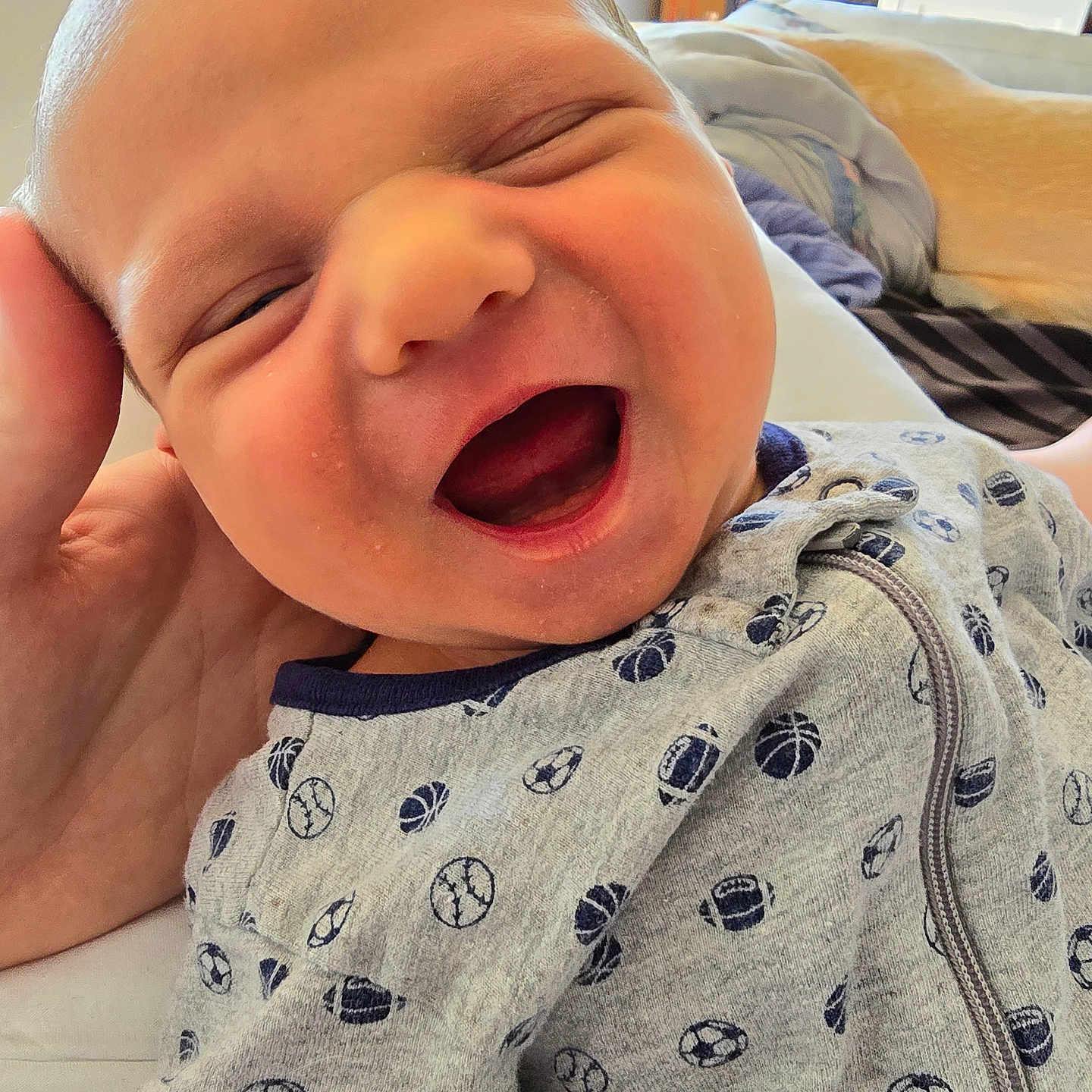 Jack is registered to the contest to win money with this photo: accessories, architecture, baby, babylaughing, bag, box, building, clothing, face, handbag, happy, head, knitwear, laughing, newborn, person, photography, portrait, smile, sweater