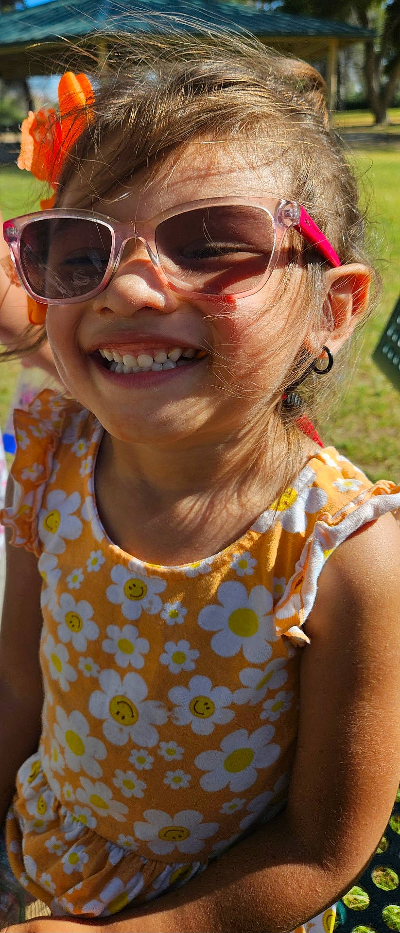 Yasmine is registered to the contest to win money with this photo: accessories, blouse, child, clothing, earring, face, female, girl, glasses, grass, happy, head, jewelry, person, photography, plant, portrait, smile, summer, sunglasses