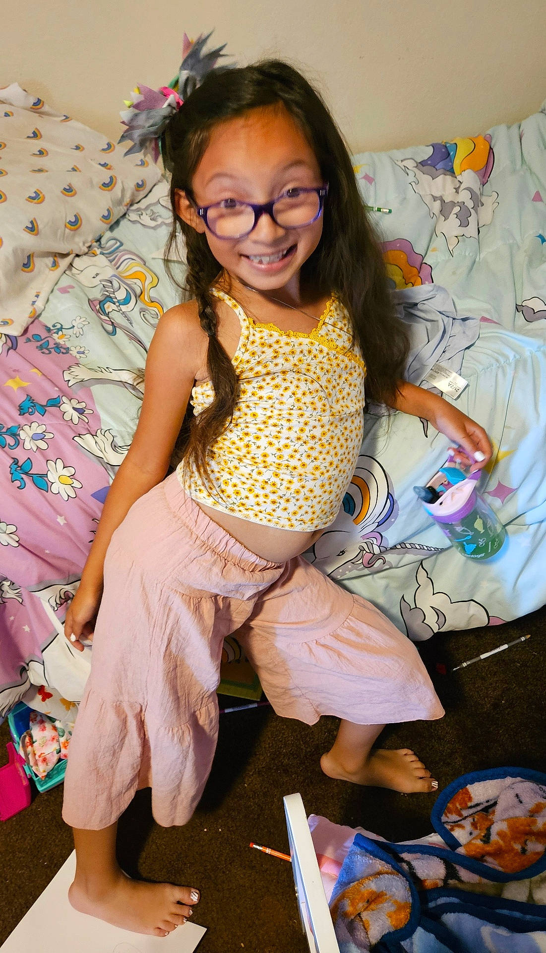 Cristiana is registered to the contest to win money with this photo: accessories, bed, bedroom, child, clothing, couch, cushion, face, female, furniture, girl, glasses, head, homedecor, indoors, pen, person, photography, portrait, shorts