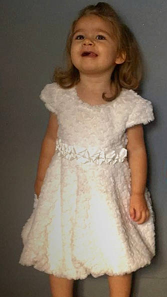 Lola participe au concours pour gagner de l'argent avec cette photo : blond, bridal_accessory, bridal_clothing, bridal_party_dress, child, day_dress, dress, embellishment, event, fashion_design, formal_wear, gown, happy, iris, joy, long_hair, neck, one_piece_garment, person, sleeve