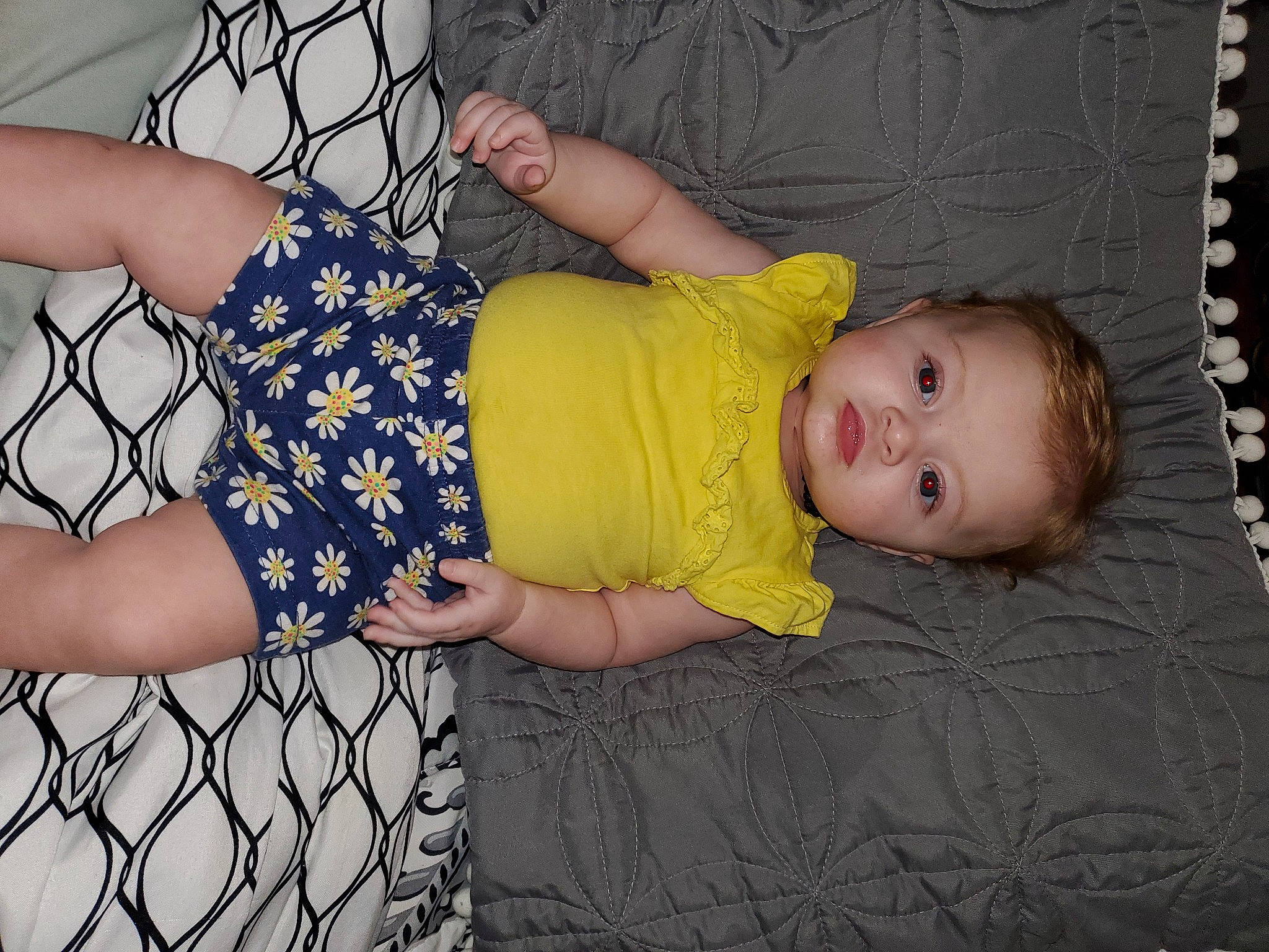 Avalina is registered to the contest to win money with this photo: baby, baby_toddler_clothing, child, comfort, dress, finger, fun, happy, human_body, human_leg, leg, pattern, person, product, sleeve, textile, thigh, toddler, trunk, vertebrate