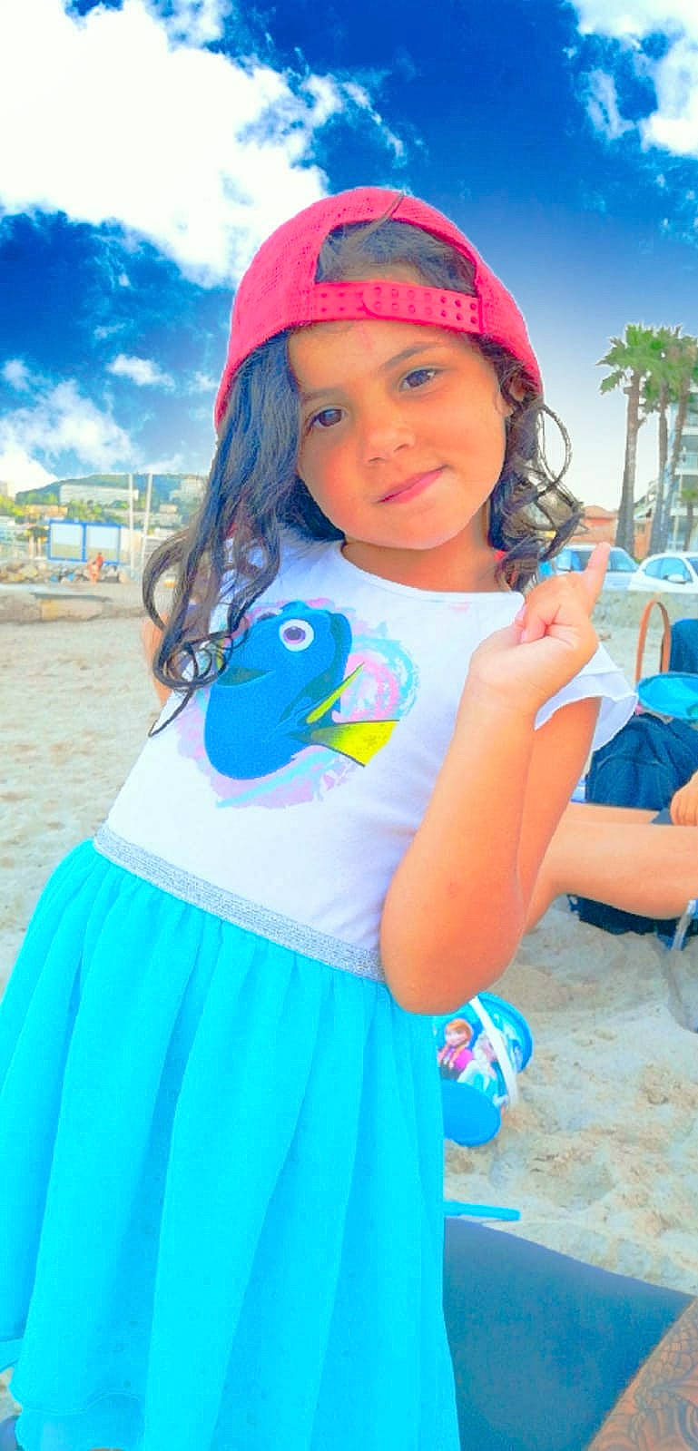 Inès a rejoint le concours — aidez-le/la à gagner de superbes lots ! aqua, blue, child, clothing, costume, electric_blue, fun, headgear, joy, person, play, sleeve, smile, summer, t_shirt, toddler, turquoise, vacation