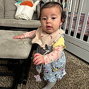 Angelina joined the competition — help win amazing prizes! baby, bib, carpet, child, clothing, crib, curly_hair, cute, furniture, indoor, nursery, ottoman, pacifier, person, pigtails, rocking_chair, standing, stuffed_animal, toddler, toy