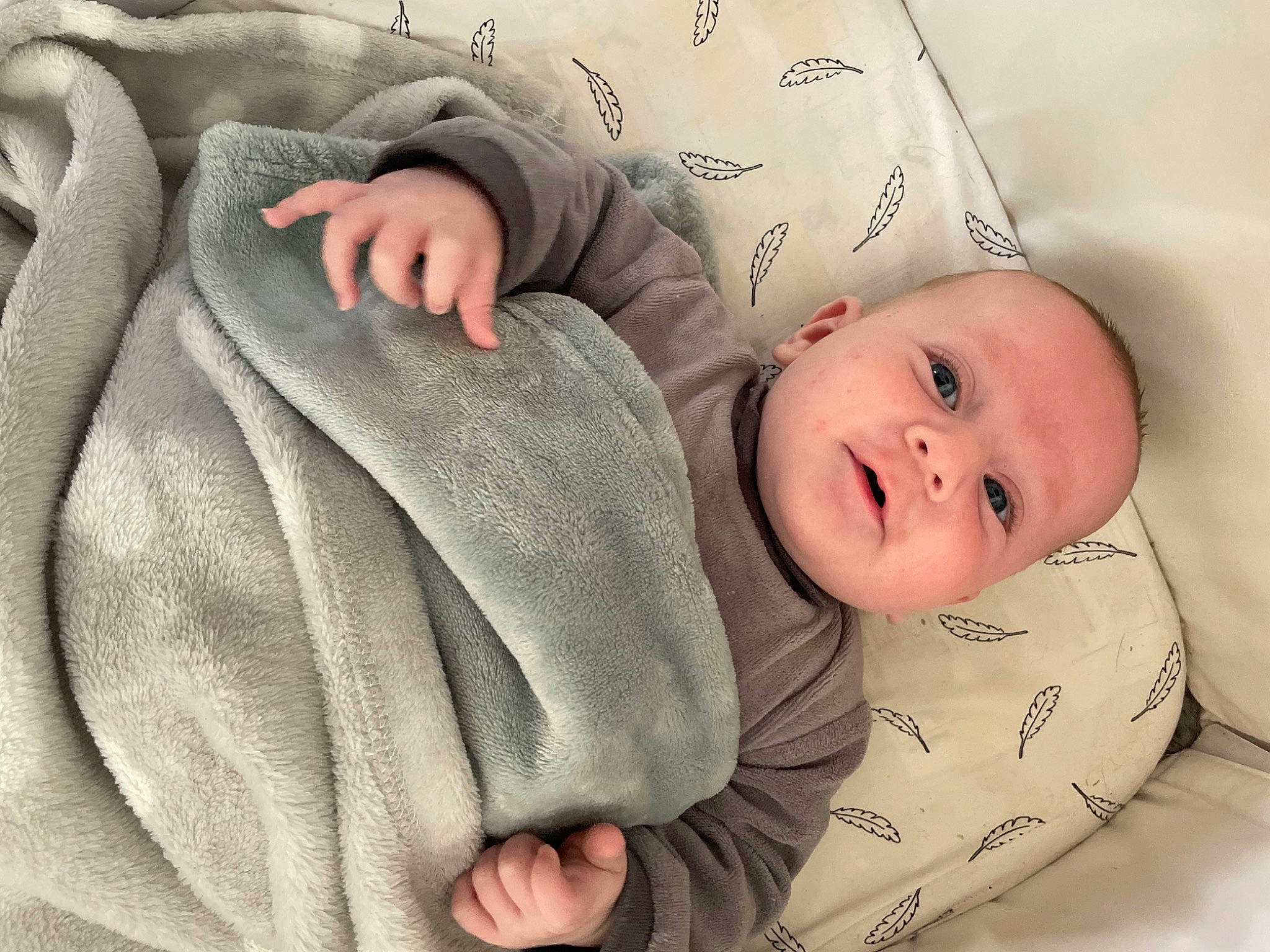 Aaron participe au concours pour gagner de l'argent avec cette photo : baby, baby_products, baby_toddler_clothing, cheek, child, comfort, eye, face, fashion_accessory, finger, gesture, happy, head, linens, pattern, person, skin, sleeve, smile, toddler