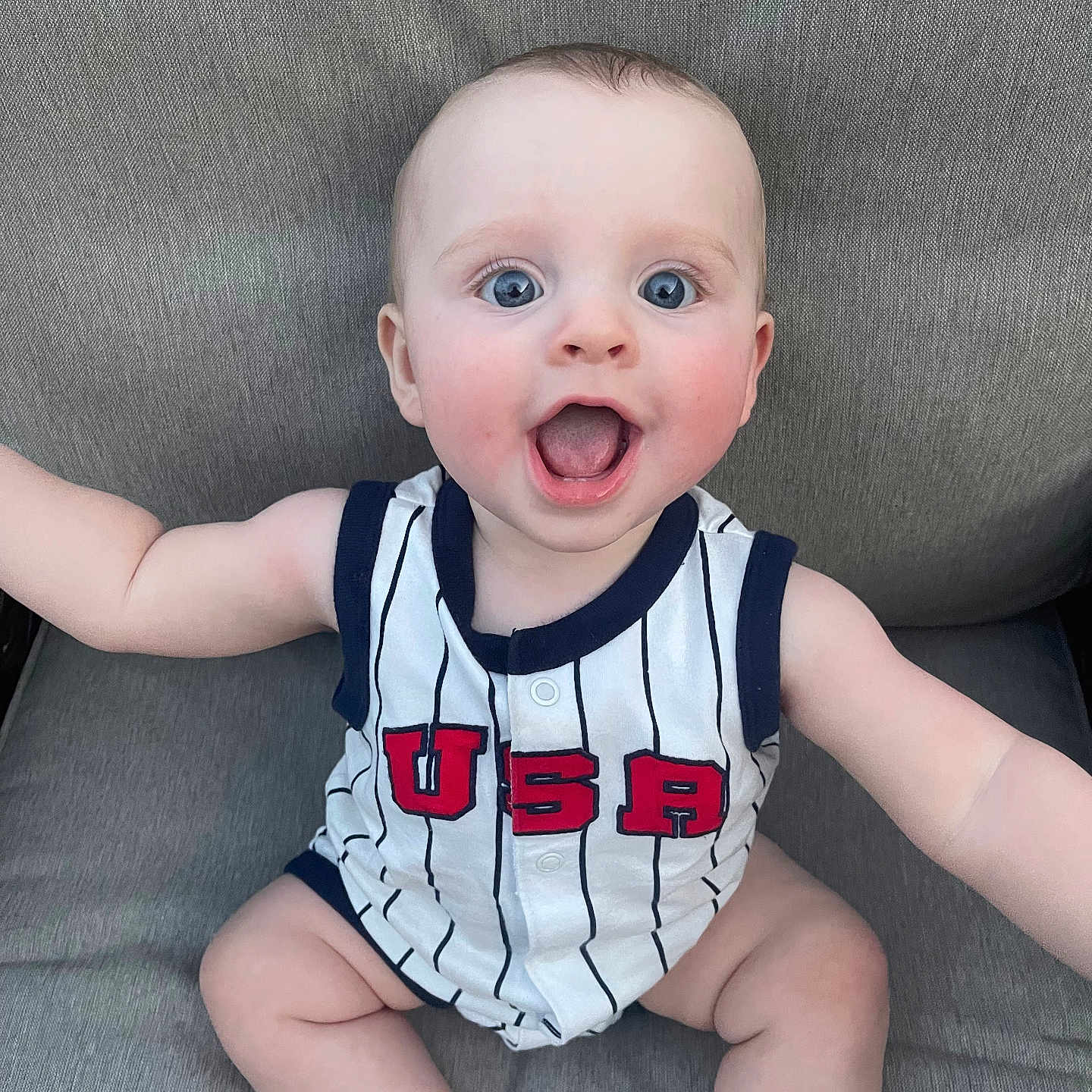 Brody joined the competition — help win amazing prizes! baby, blue_eyes, casual, child, clothing, cute, expression, fabric, face, happy, indoor, infant, onesie, person, portrait, seat, sitting, skin, smiling, usa