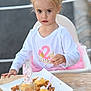 child, toddler, birthday, cake, candle, high_chair, white_shirt, pink_tutu, dessert, table, outdoor, celebration, face, person, food, party, young_child, cute, serious, event