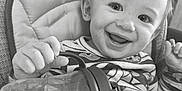 Khost joined the competition — help win amazing prizes! baby, high_chair, sippy_cup, smile, child, indoor, happy, face, clothing, person, table, feeding, young_child, cute, infant, expression, holding, seat, joyful, portrait