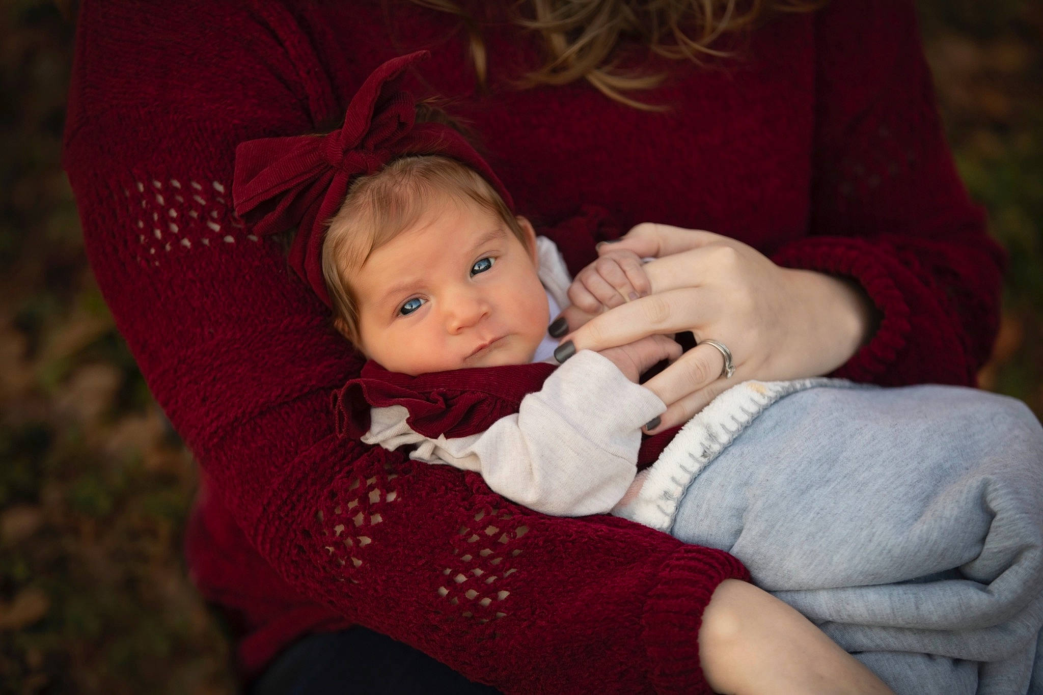 Peyton is registered to the contest to win money with this photo: baby, baby_toddler_clothing, cheek, child, comfort, eye, finger, gesture, grass, happy, iris, lap, outerwear, person, plant, sitting, skin, sleeve, toddler, tree