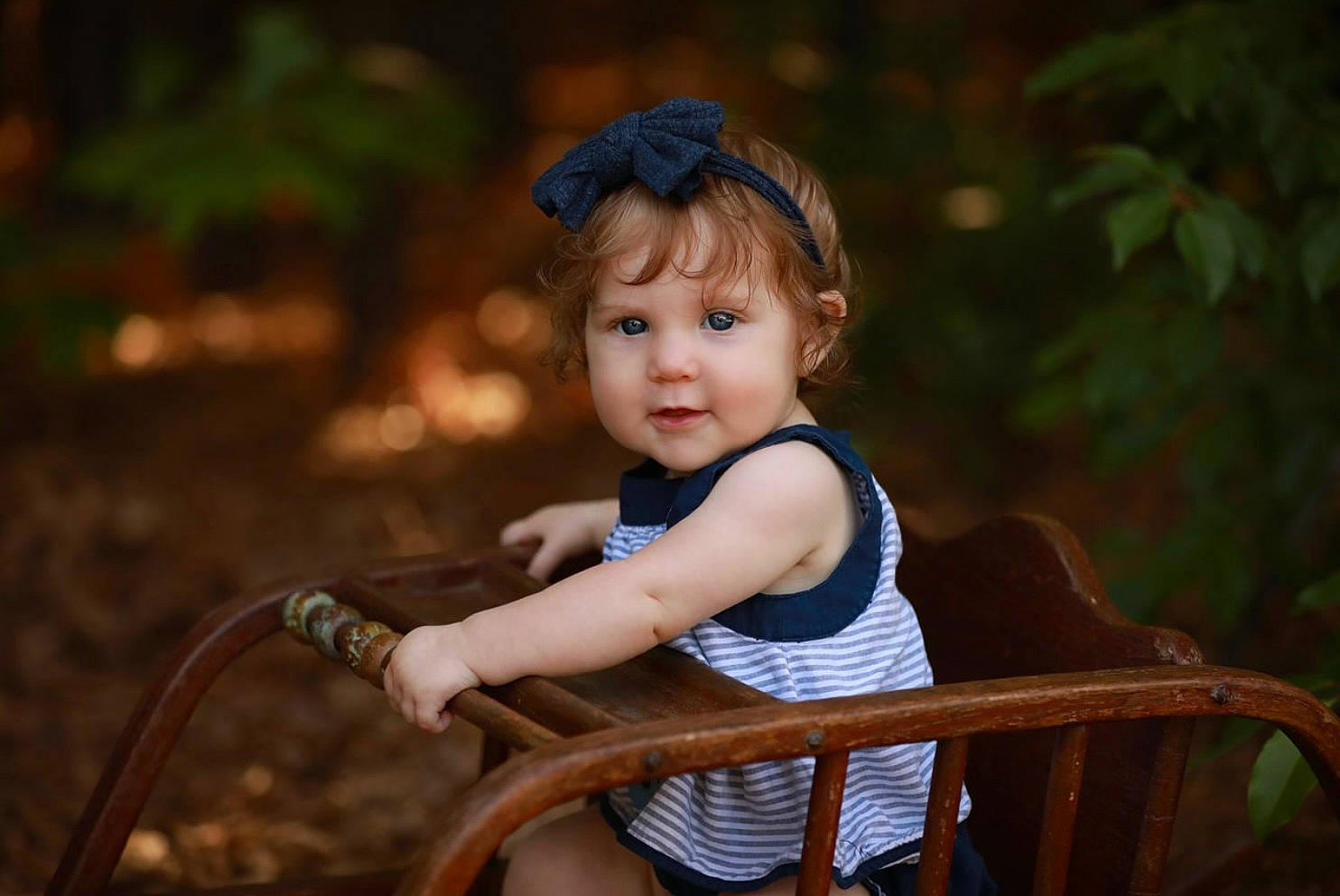 Peyton is registered to the contest to win money with this photo: baby, baby_toddler_clothing, bangs, chair, child, flash_photography, fun, grass, happy, hat, iris, leisure, people_in_nature, person, portrait_photography, recreation, sitting, skin, toddler, vacation