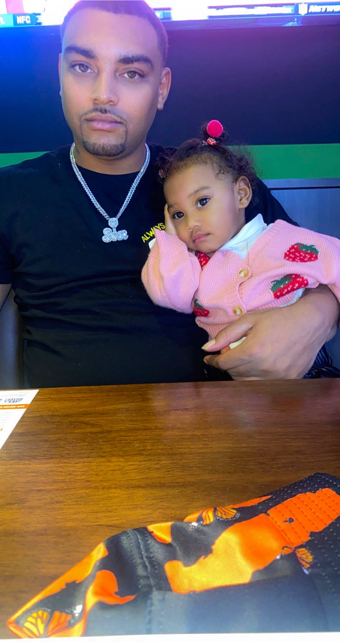 Liberty is registered to the contest to win money with this photo: baby, black, blue, chair, child, desk, event, fun, happy, head, human, leisure, person, red, skin, t_shirt, table, toddler, white, wood