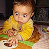 Valentina a rejoint le concours — aidez-le/la à gagner de superbes lots ! baby, brown_hair, child, close_up, crawling, curiosity, expression, flash, floor, hands, indoor, infant, mat_pattern, person, play_mat, portrait, surprised, toys, wide_eyes, yellow_jacket