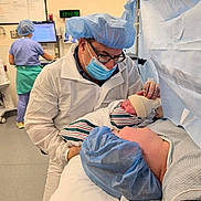 Noah joined the competition — help win amazing prizes! newborn, baby, infant, child, hospital, operating_room, medical_staff, doctor, surgeon, nurse, scrubs, surgical_mask, surgical_cap, protective_clothing, mother, father, birth, blanket, bed, medical_equipment
