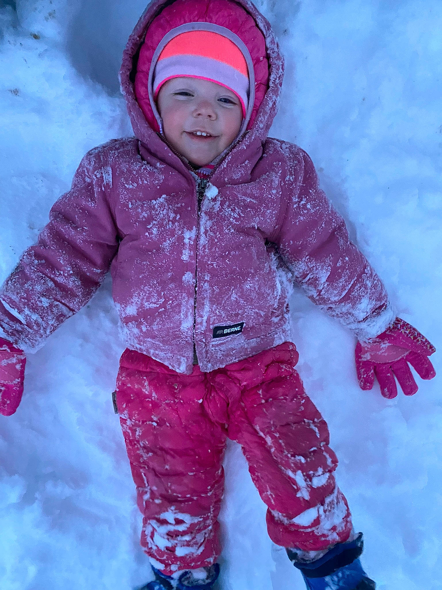 Addilyn is registered to the contest to win money with this photo: baby_toddler_clothing, face, freezing, fun, glove, happy, headwear, jacket, magenta, outdoor_recreation, people_in_nature, person, pink, purple, recreation, red, sleeve, slope, smile, snow