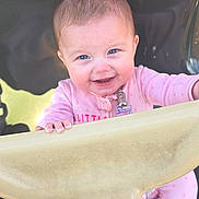 Faye joined the competition — help win amazing prizes! baby, baby_hair, blue_eyes, closeup, foot, grip, hand, happy, infant, onesie, outdoor, pacifier_clip, pink_outfit, playground, portrait, safety_bar, seat, smiling, sunlight, swing_seat