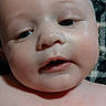 Kurvin Tanner is registered to the contest to win money with this photo: baby, face, skin, closeup, expression, eyes, mouth, cheeks, child, infant, portrait, head, human, person, young, cute, indoors, blanket, texture, soft
