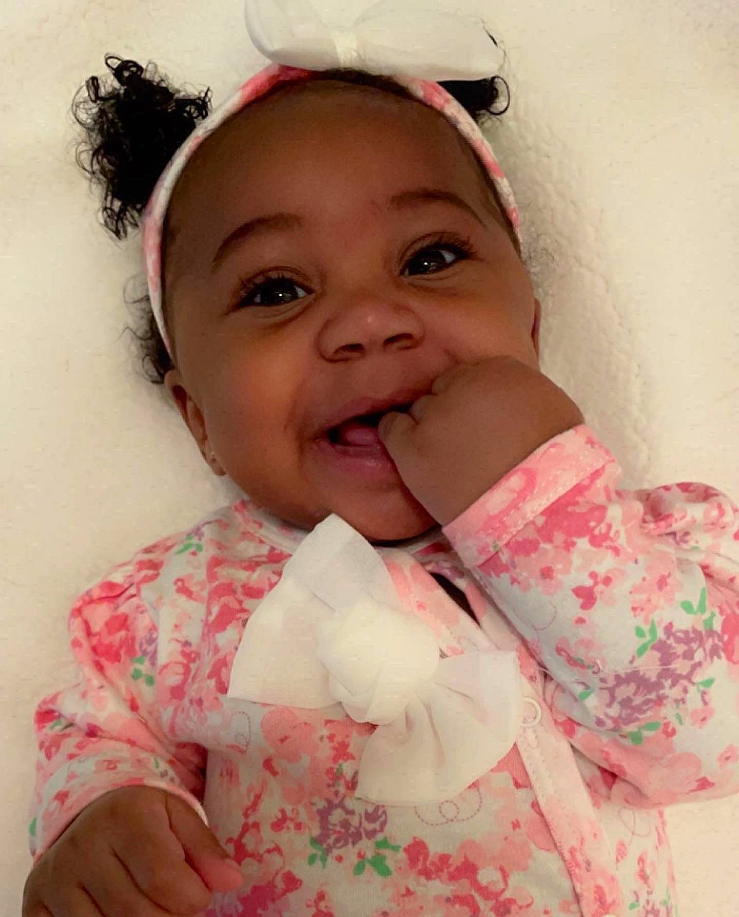 Ahlayla Rose joined the competition — help win amazing prizes! baby, baby_toddler_clothing, cheek, child, ear, eyelash, finger, gesture, happy, headband, headpiece, jaw, lip, nose, person, pink, skin, sleeve, smile, textile