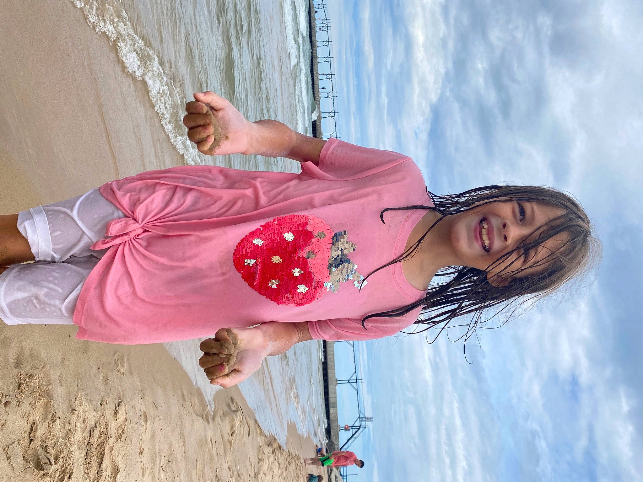 Wendy is registered to the contest to win money with this photo: abdomen, beach, blond, cloud, dress, fun, happy, human_leg, joy, landscape, leisure, magenta, people_in_nature, person, pink, sky, summer, textile, thigh, vacation