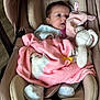 baby, blanket, car_seat, child, clothing, comfort, cute, expression, face, footwear, head, indoor, infant, person, pink, plush_toy, rest, soft, toy, white