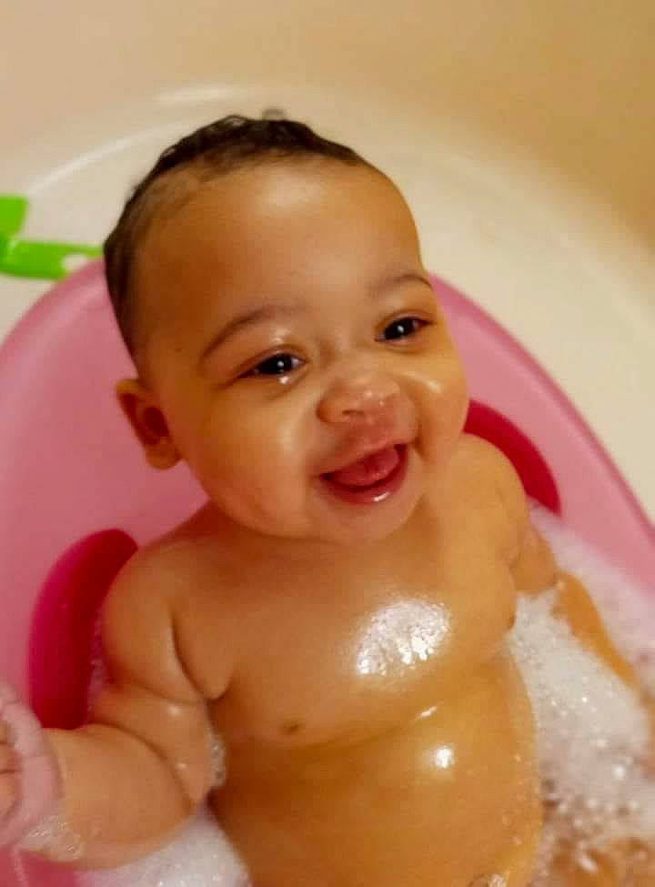 Brinley is registered to the contest to win money with this photo: arm, baby, baby_bathing, bathroom, bathtub, cheek, chest, ear, face, fluid, head, human_body, iris, joy, lip, mouth, neck, nose, person, skin