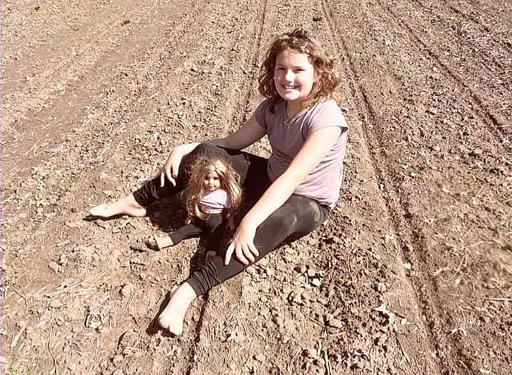 Tinslee is registered to the contest to win money with this photo: canidae, carnivore, child, dog, fun, happy, hunting_dog, joy, labrador_retriever, mud, person, photography, play, pointing_breed, retriever, smile, soil, sporting_group