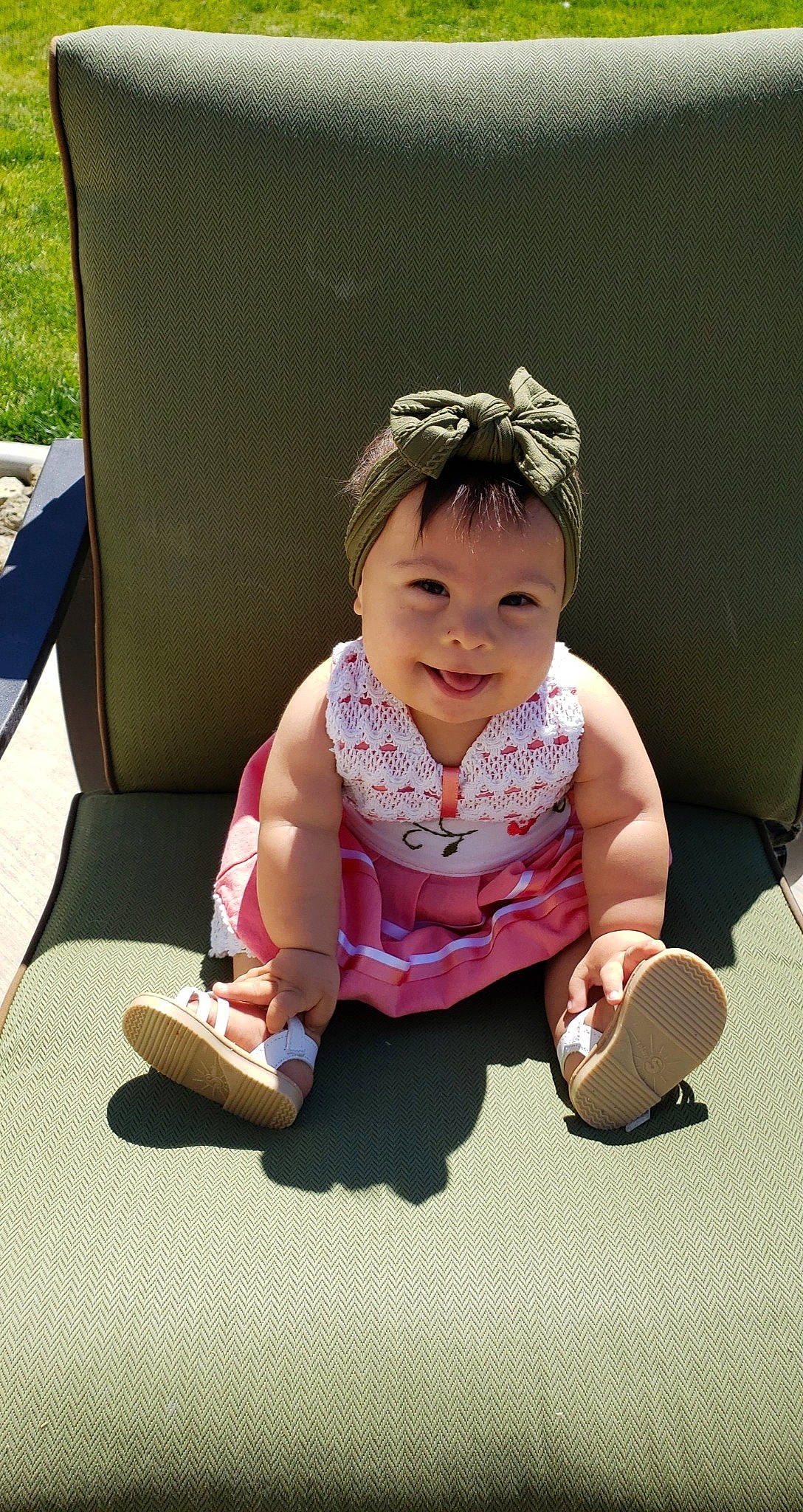 Mía joined the competition — help win amazing prizes! baby, baby_toddler_clothing, child, face, fashion_accessory, fun, grass, happy, head, joy, leisure, magenta, person, pink, play, recreation, sitting, skin, sleeve, smile