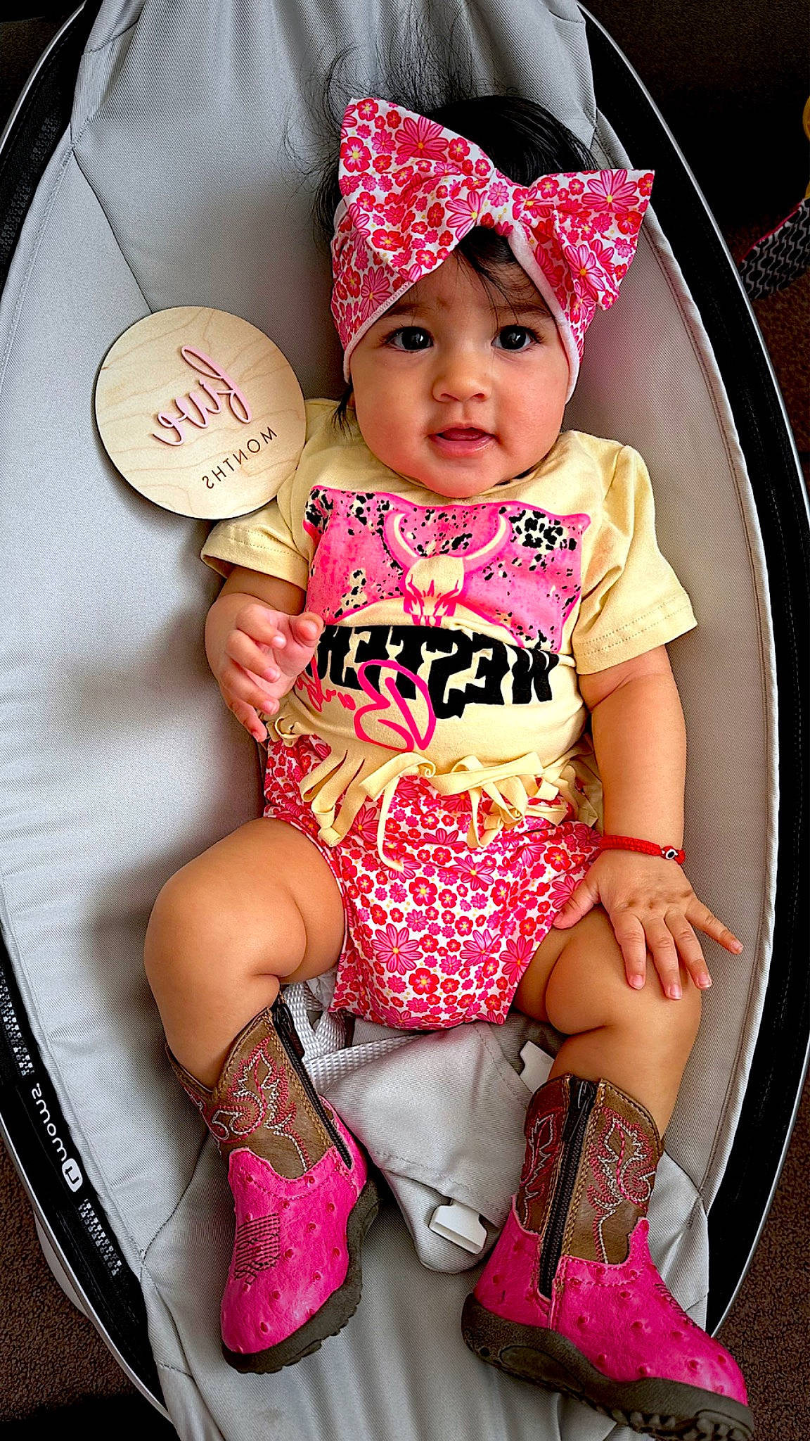 Maddison joined the competition — help win amazing prizes! baby, baby_toddler_clothing, cap, chair, child, costume_hat, fashion_accessory, happy, headgear, headwear, human_body, human_leg, leg, magenta, organ, party_supply, person, pink, sleeve, t_shirt